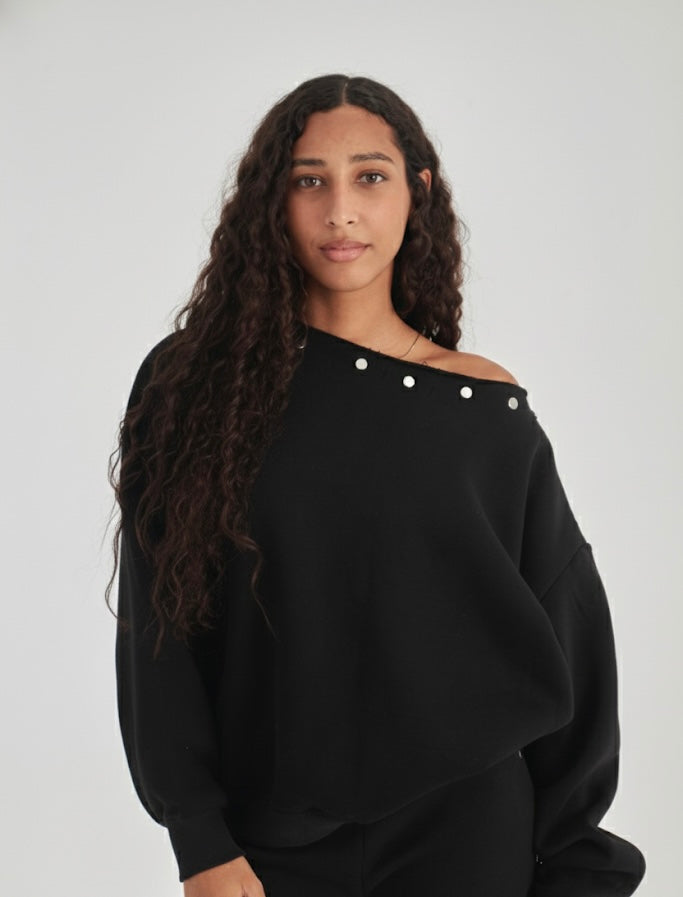 Studded black off-shoulder sweater