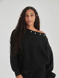 Studded black off-shoulder sweater