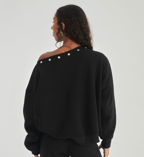 Studded black off-shoulder sweater