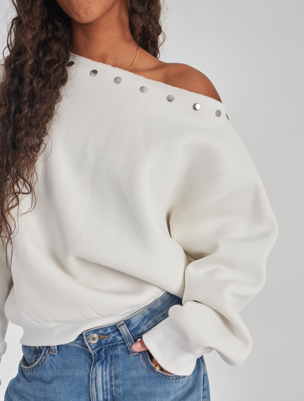 Studded white off-shoulder sweater
