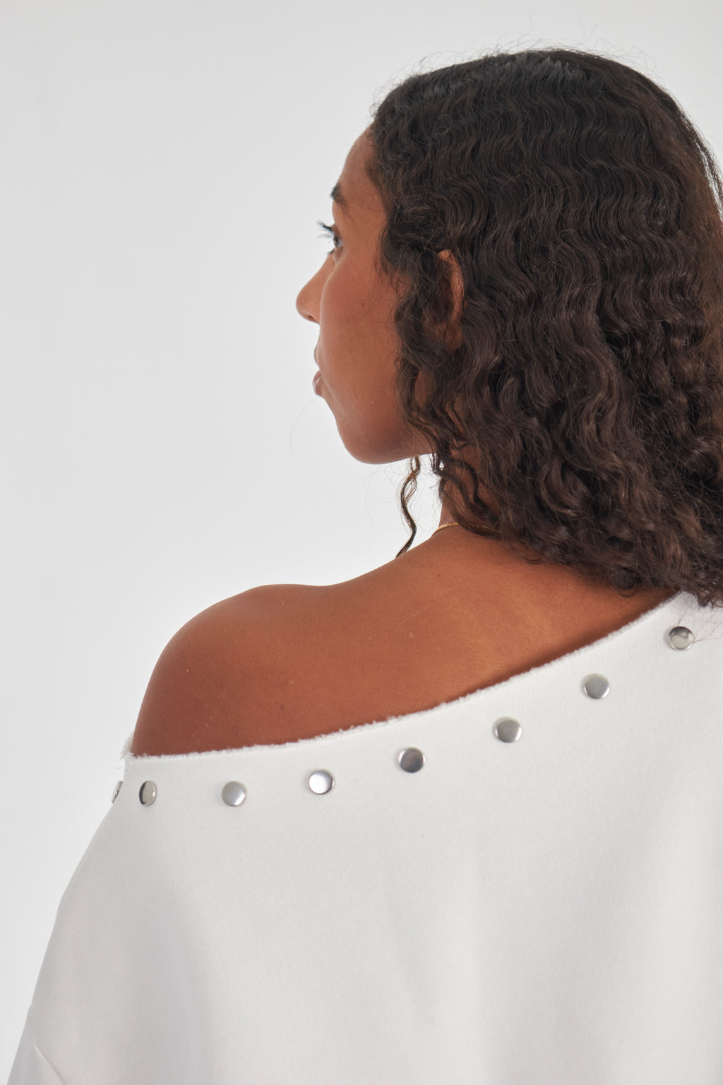 Studded white off-shoulder sweater